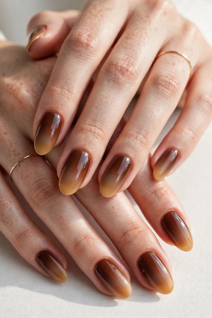 chestnut ombre oval nail design with delicate-stroke artistry on oval nails in amber, caramel and warm cinnamon